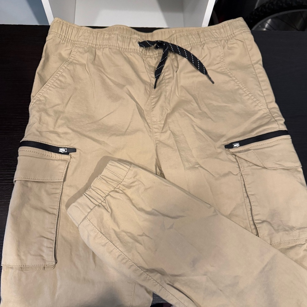 New, never used. Old Navy Tech joggers in dark gray. Youth XL (14-16)